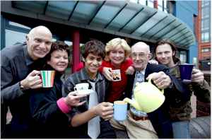The cast enjoy a break from rehearsal